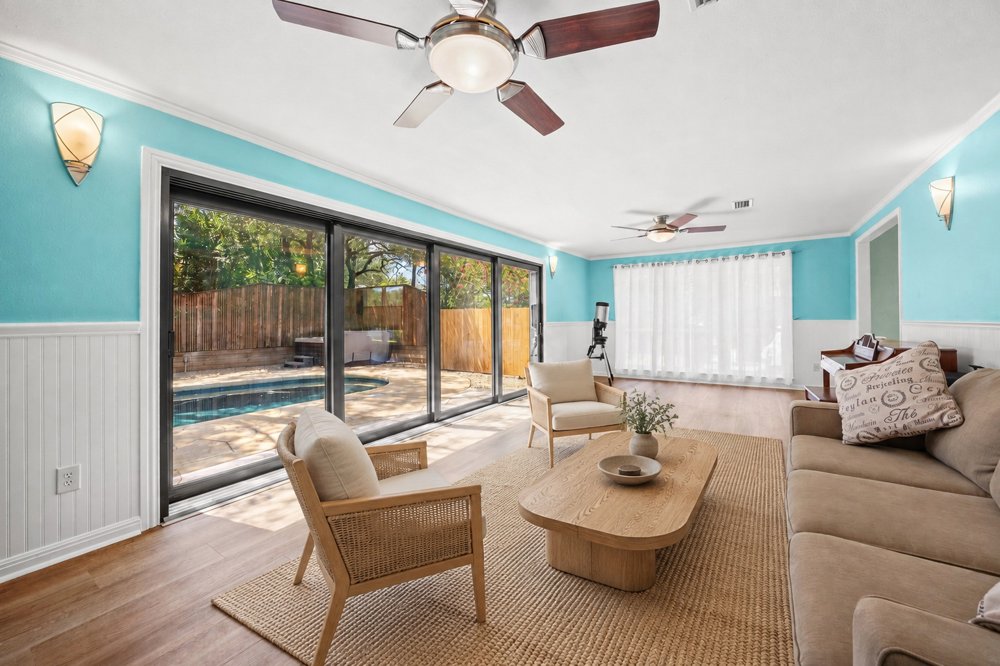 Virtually staged Austin sunroom with organic modern furnishings